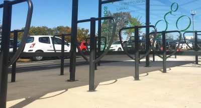Lyre 1 hoops under an open bicycle shelter