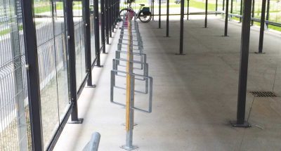 Lyre 3 bicycle racks with wood protection installed in a bicycle garage